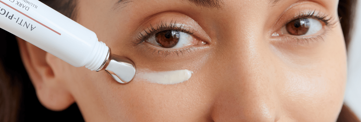 Woman applying Eucerin Anti-Pigment Eye Care to her undereye