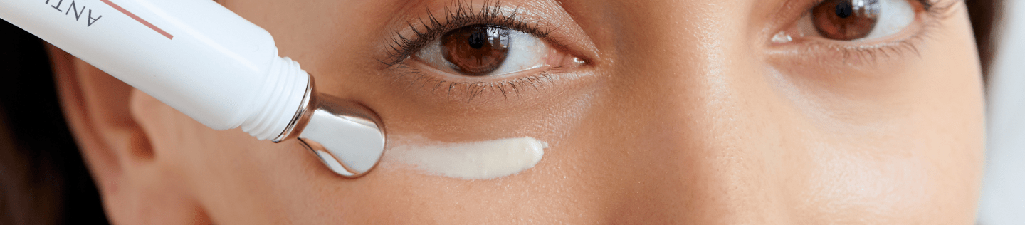 Woman applying Eucerin Anti-Pigment Eye Care to her undereye