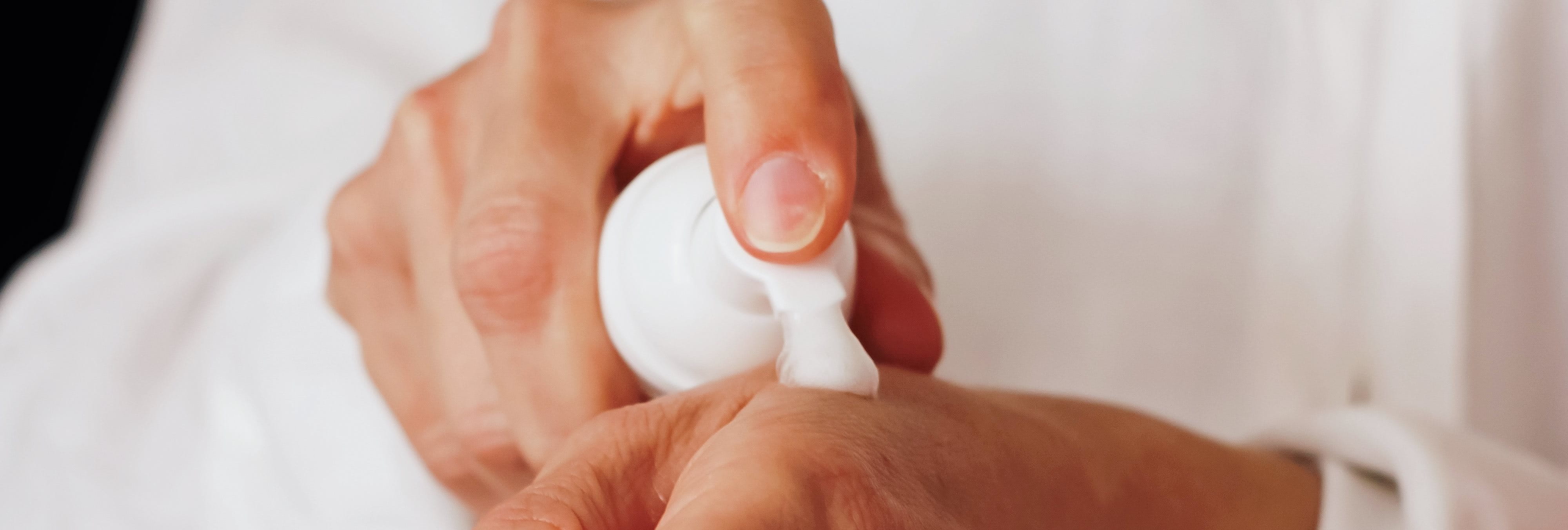 Applying lotion to hands