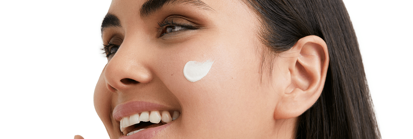 woman moisturising as part of skincare routine for dry skin