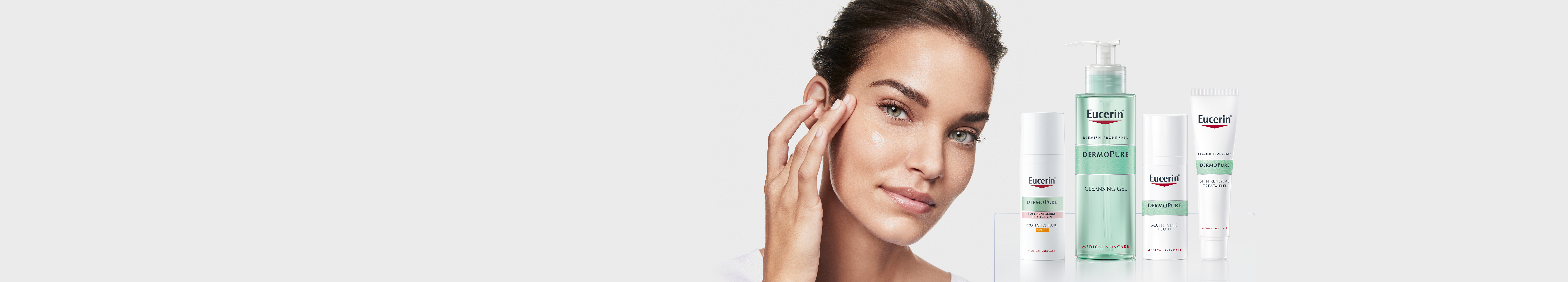 žena drži Euceirn DermoPure njegu u ruci