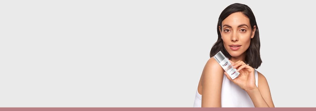 Girl with Eucerin Skincare Product