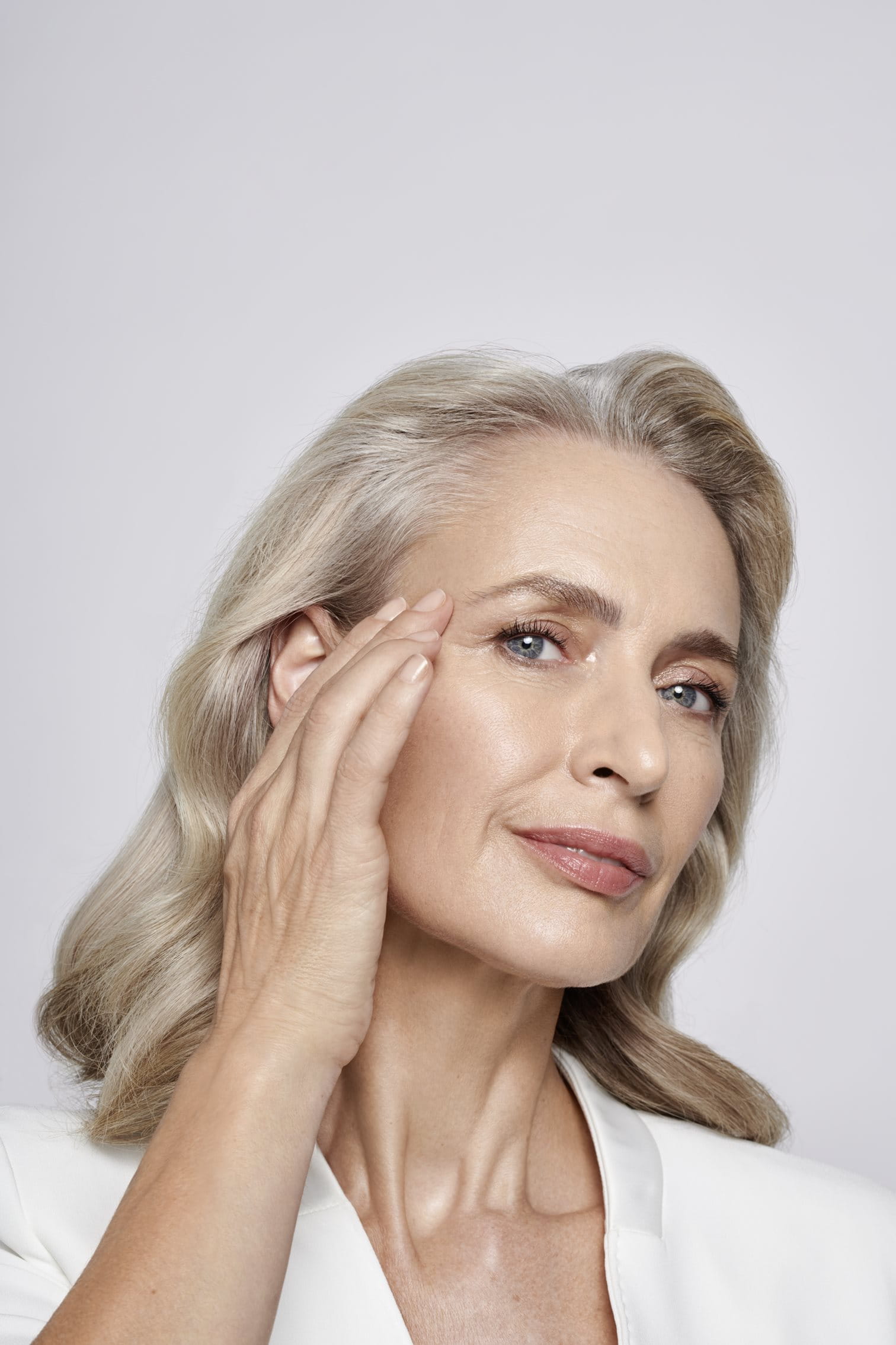 A woman with mature skin and less appearance of frown lines.