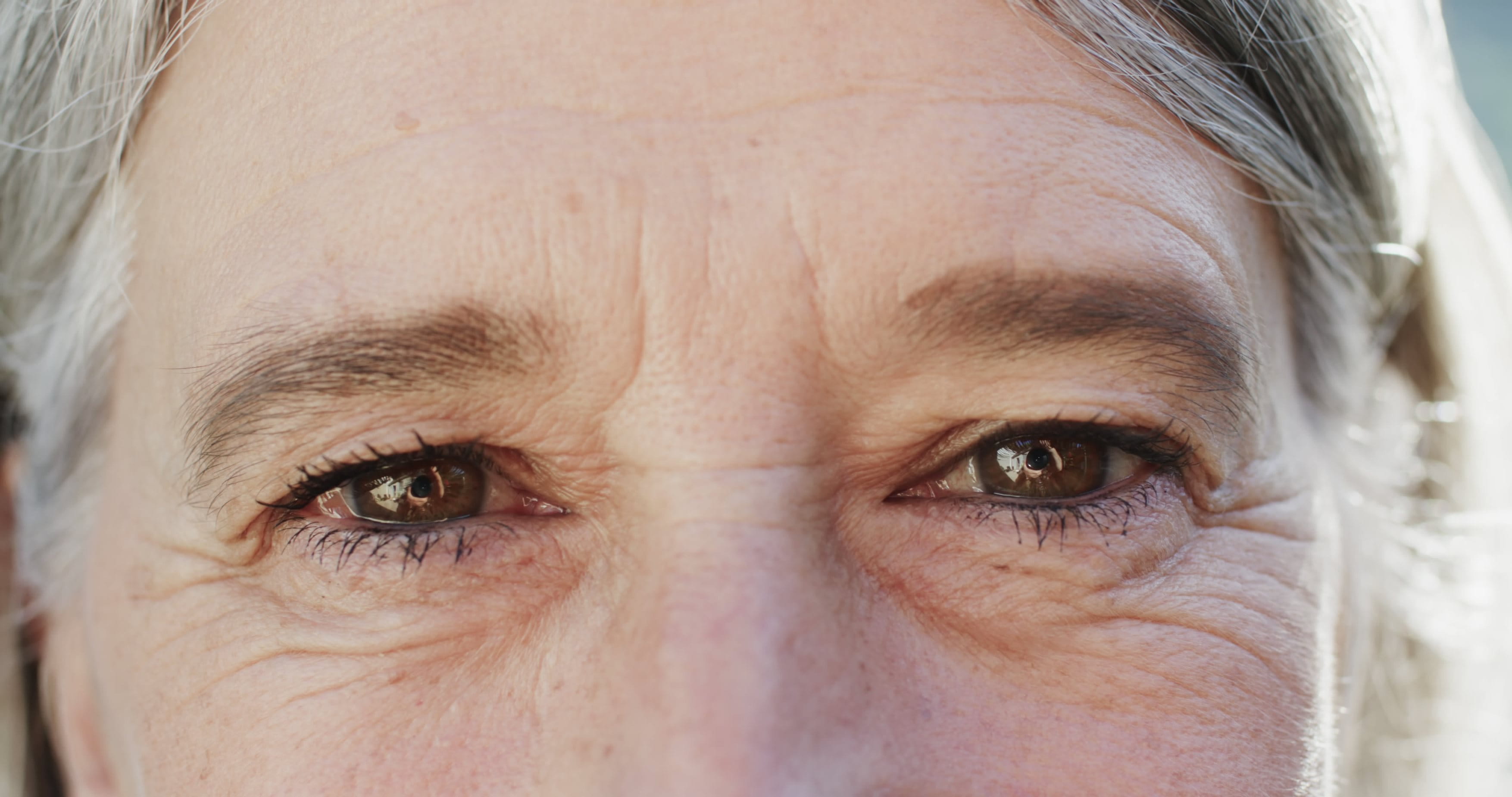 a close up look of a woman with mature skin and frown lines