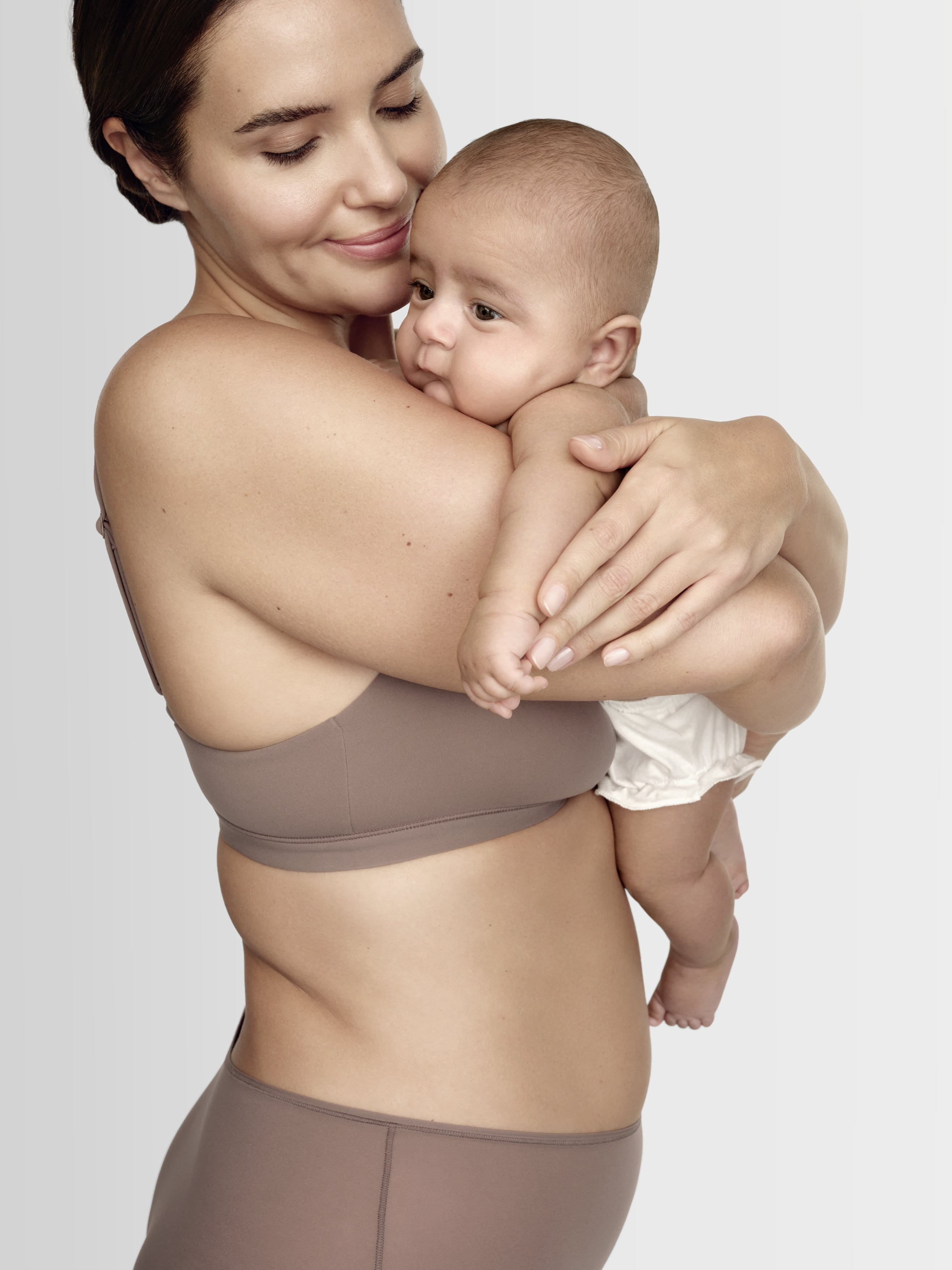 woman holding baby 