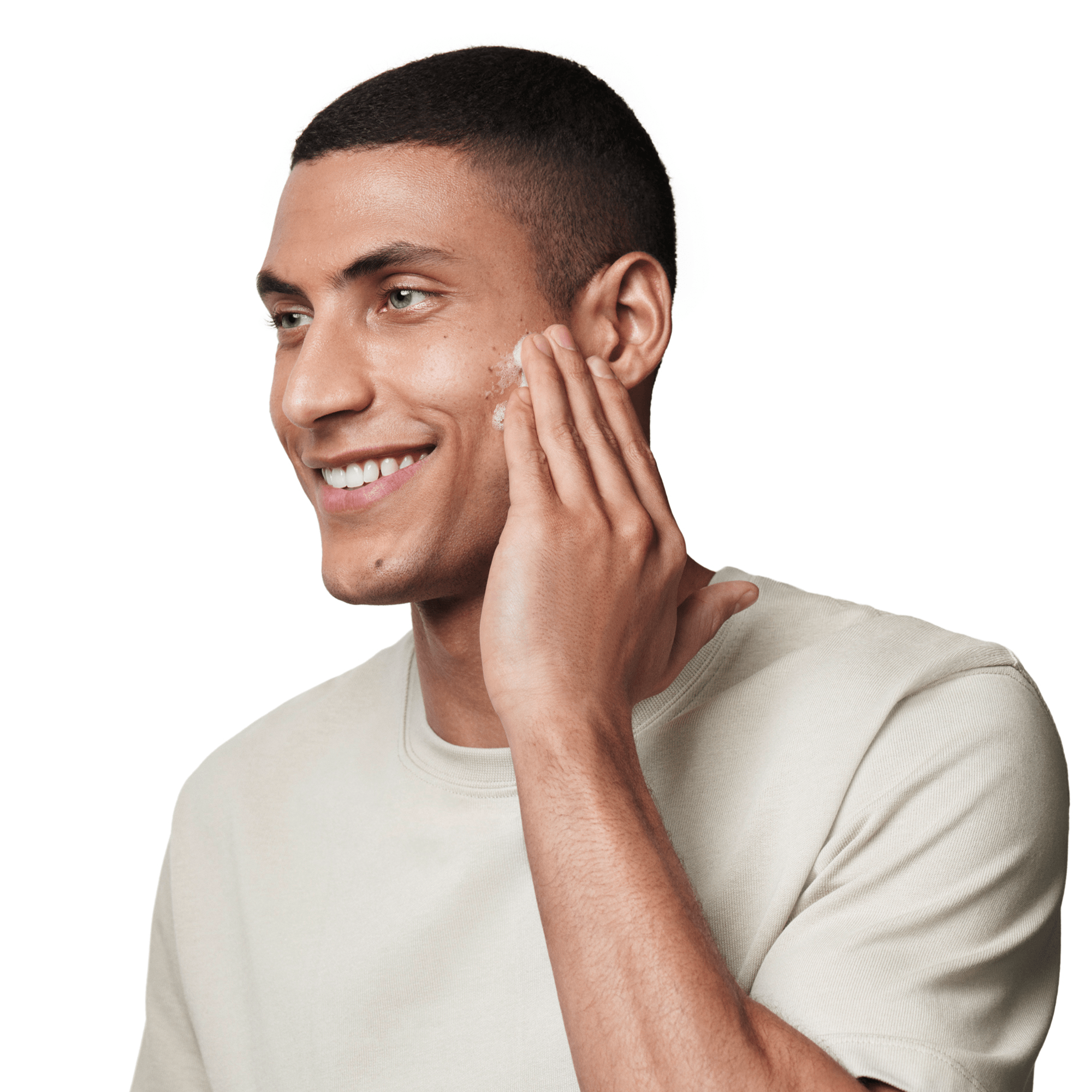 a guy applying moisturiser to his face