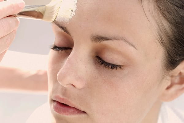 Woman using chemical peel