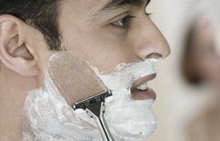 Man shaving his face