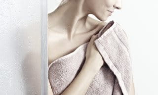 Woman wrapped in a towel.