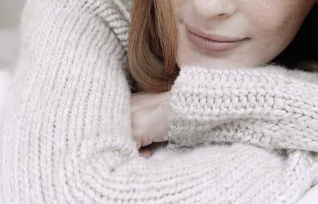 Woman wearing cotton pullover.
