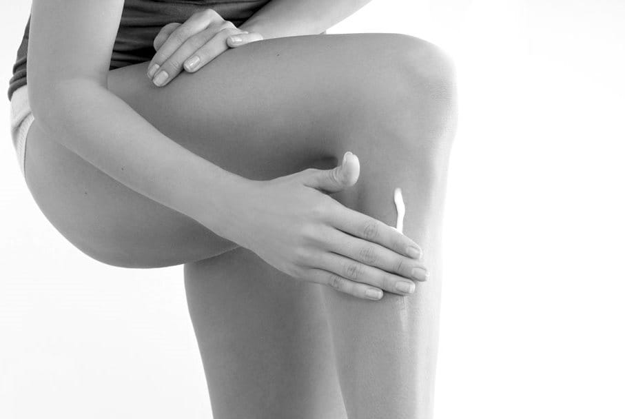 Woman touching her right arm