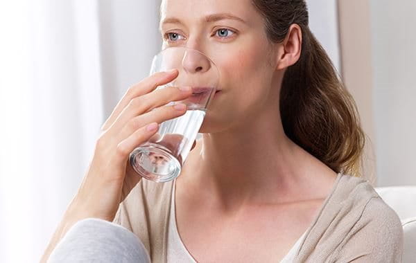 Woman drinking a glass of water