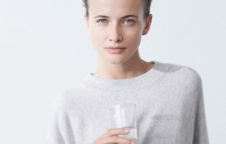 Woman holding a glas of water