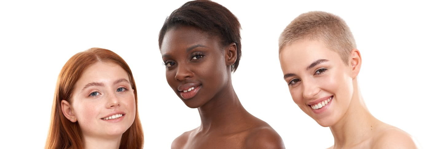 Drei Frauen mit unterschiedlicher Hautpigmentierung