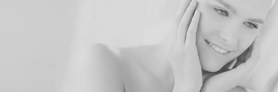 Woman holding her face smiling