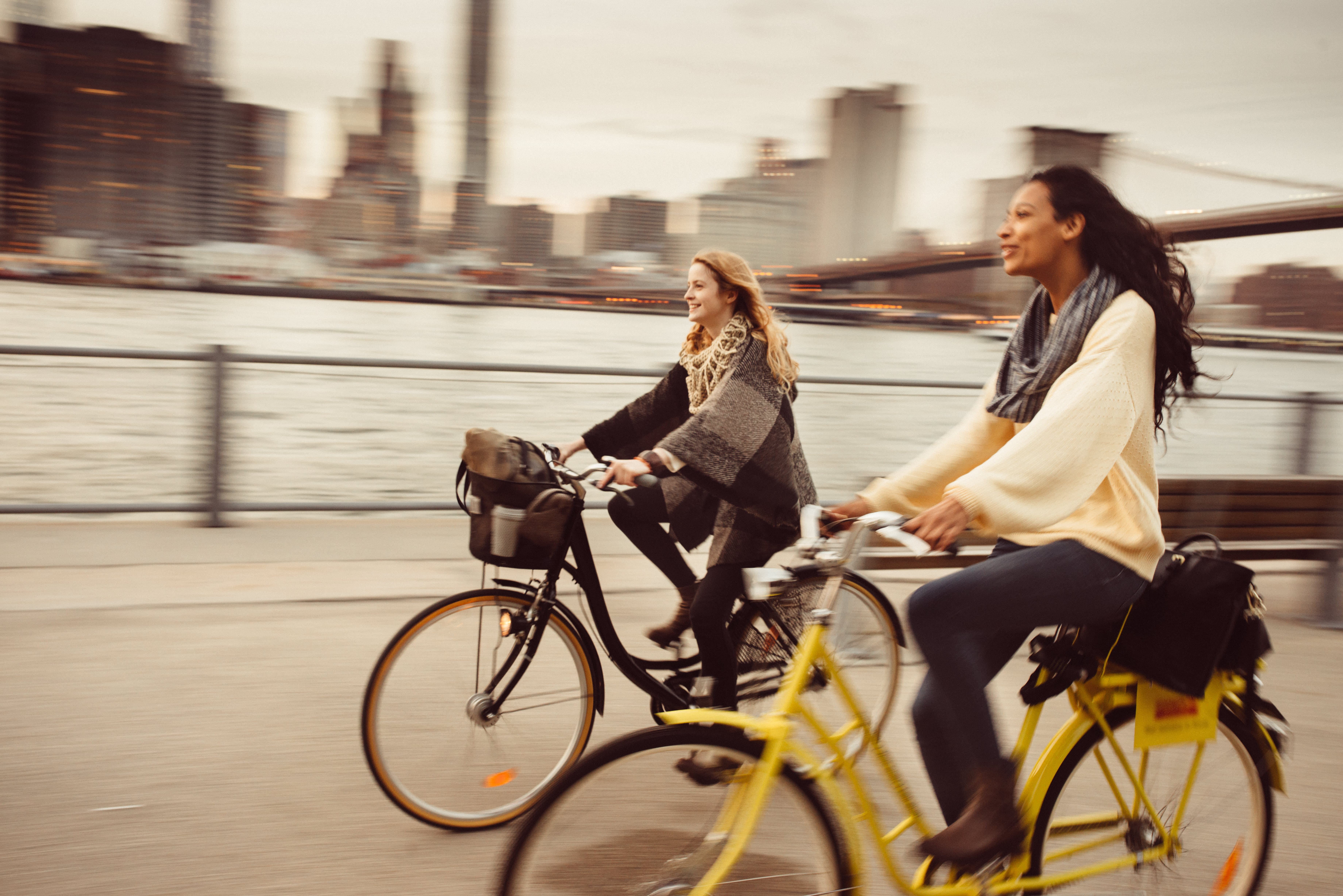 Two women riding their bikes
