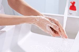 Woman washing her hand