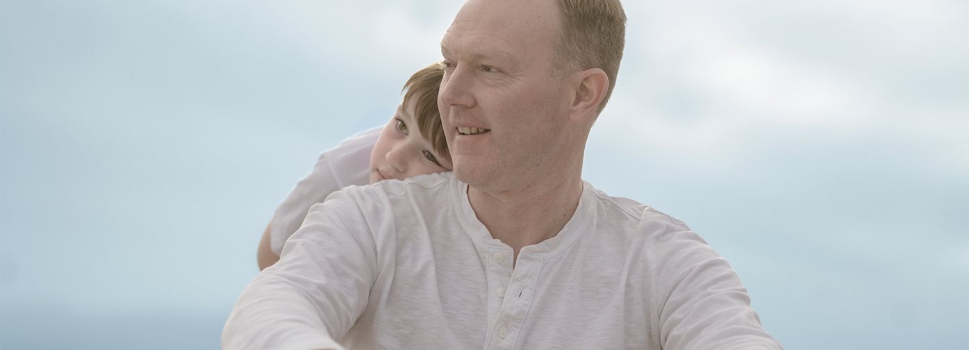 Man with son wearing Eucerin Actinic Control