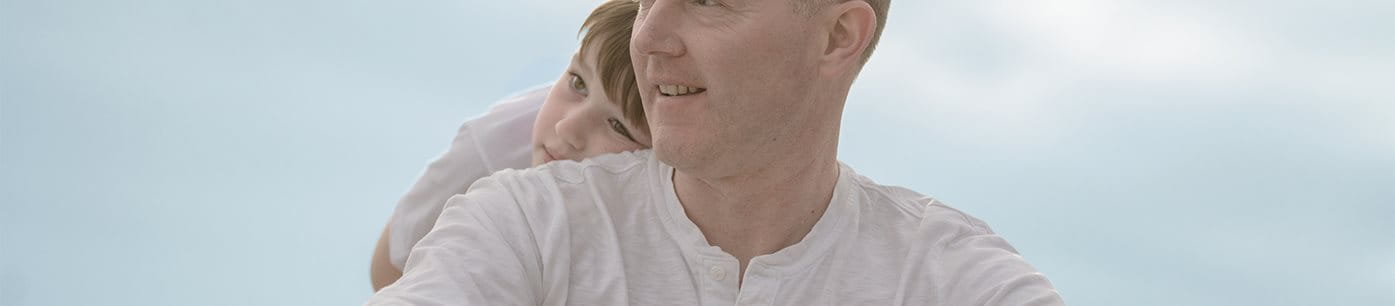 Man with son wearing Eucerin Actinic Control