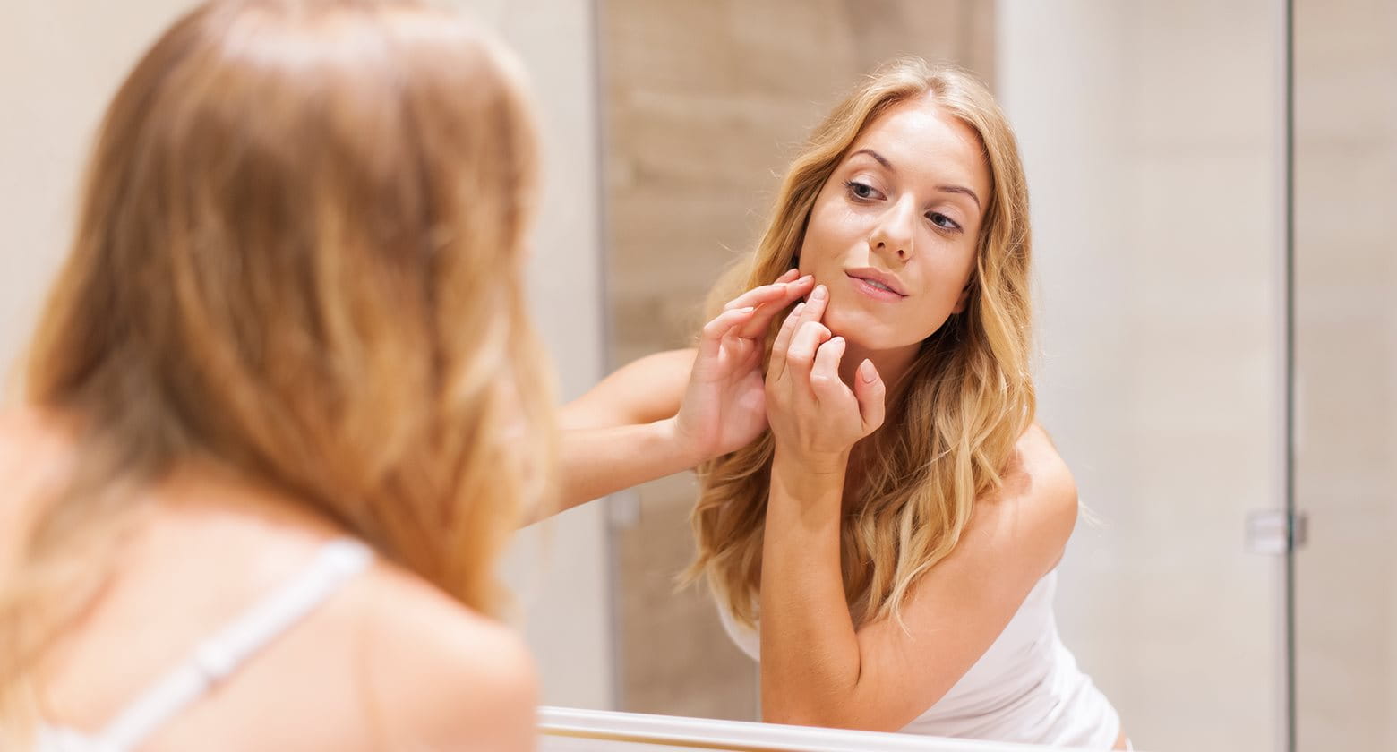 woman suffering from adult acne