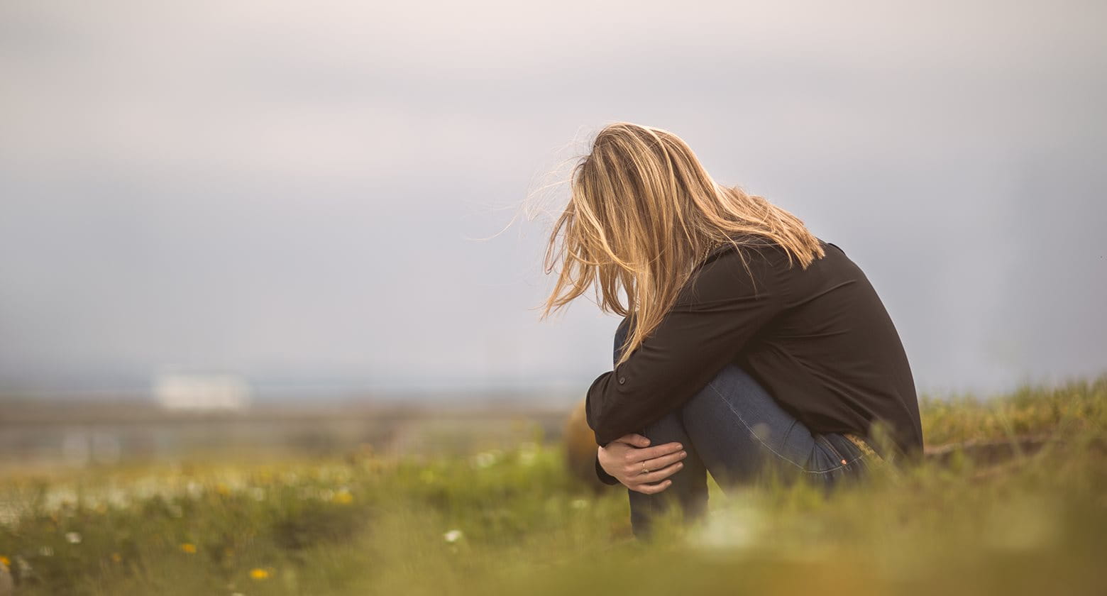 Woman suffering from acne depression