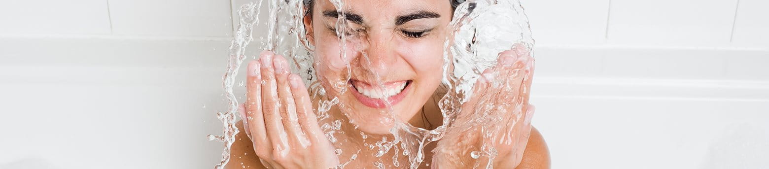 woman cleaning face
