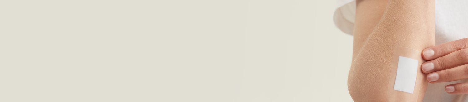 Close up shot of a large plaster on a forearm