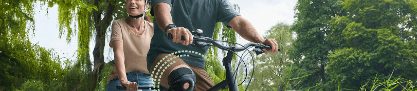 Man and woman riding a tandem bicycle