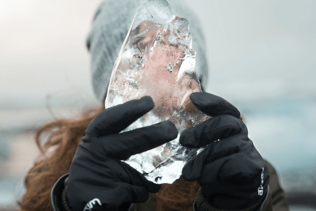 woman holding block of ice