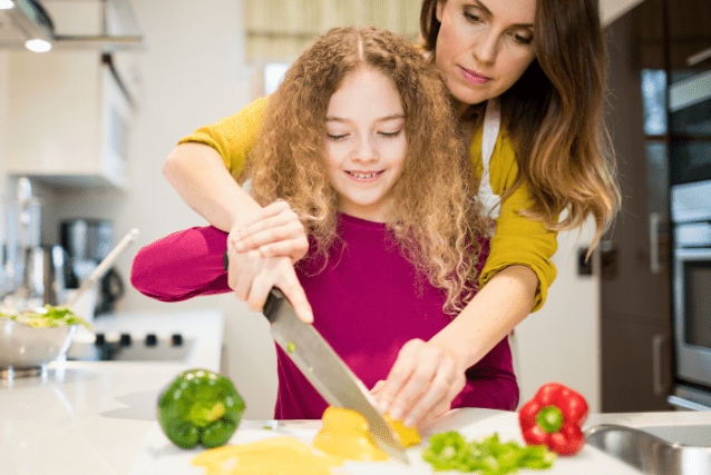mother cooking with daughter