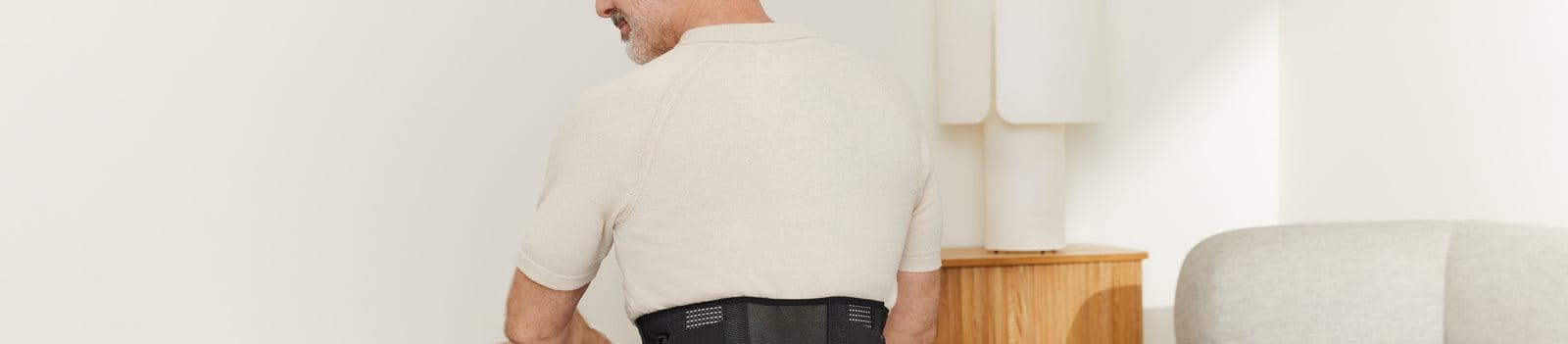 man wearing back support