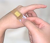 Seal the plaster across the wound