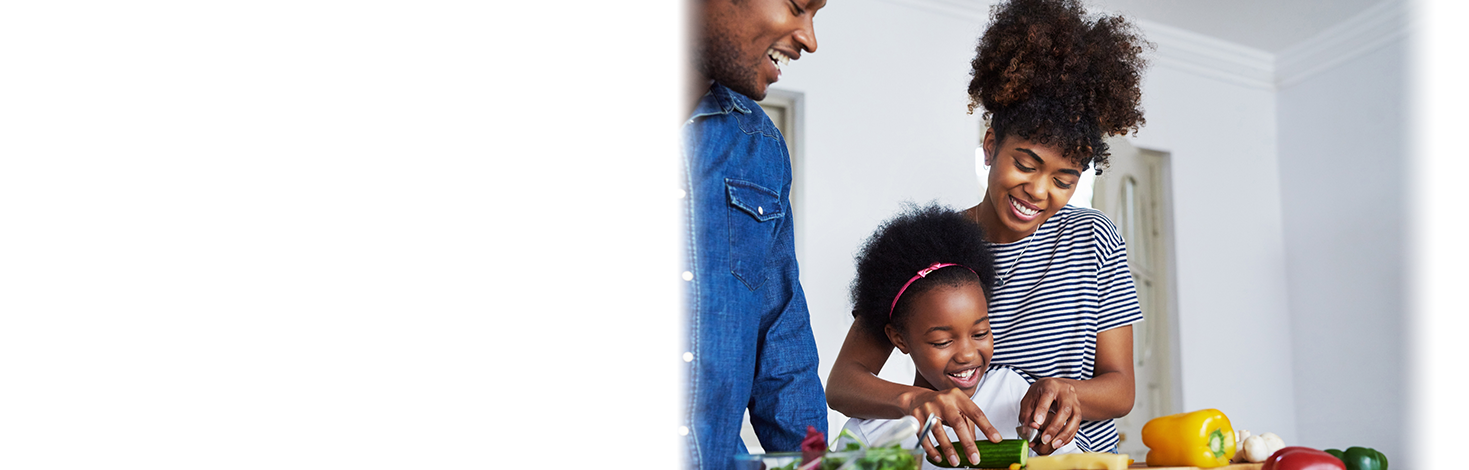Mother and daughter in kitchen preparing fruit