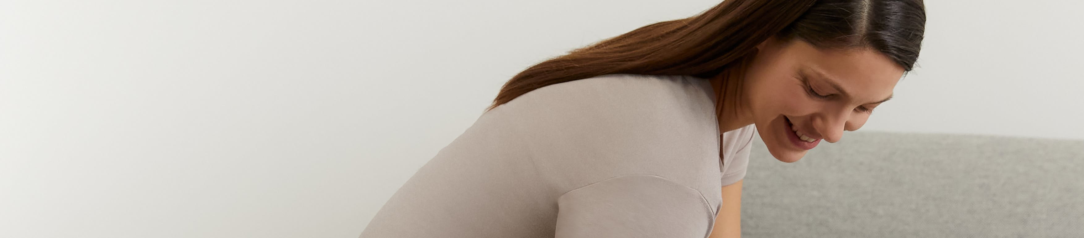 Woman smiling as she looks down