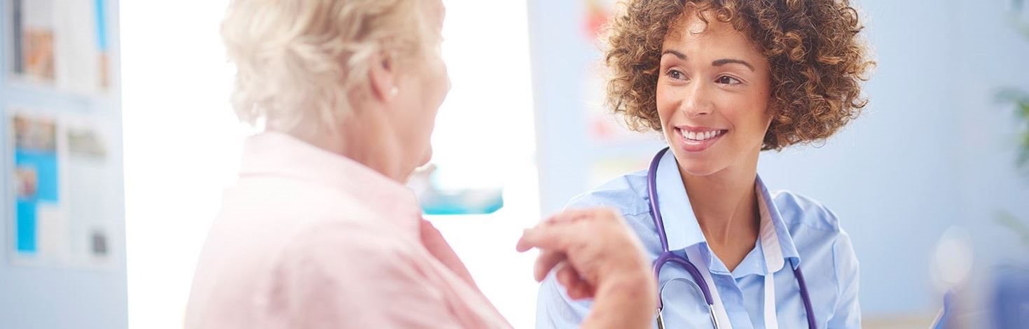 Doctor placing bandage on a wound